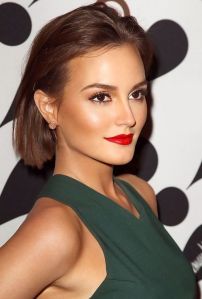 Leighton Meester has gone for a simple makeup look. She used bright red lipstick to make her simple makeup look chic. 